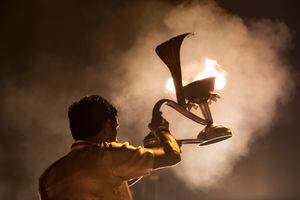 A burning candle shaped like a cobra, used by priests performing Agni Pooja, a Worship to Fire ceremony at Dashashwamedh Ghat in Varanasi, India