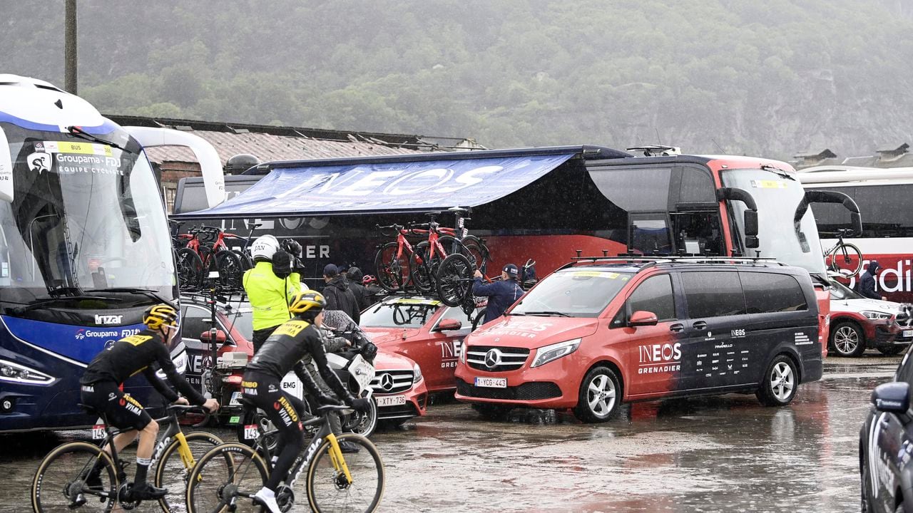 Cyclists' bicycles are loaded onto vehicles after the first section of stage 13 of the Giro d'Italia cycling race, from Borgofranco d'Ivrea to Crans Montana, Switzerland, was canceled due to bad weather conditions, in Borgofranco d'Ivrea, Italy, Friday, May 19, 2023. (Fabio Ferrari/LaPresse via AP)