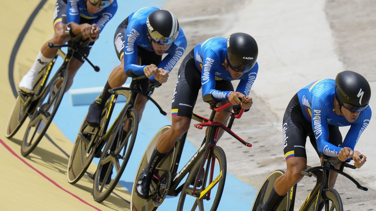Colombia competes in the men's cycling track team pursuit qualifying heats at the Central American and Caribbean Games in San Salvador, El Salvador, Wednesday, June 28, 2023. (AP Photo/Arnulfo Franco)