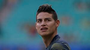 Colombia's James Rodriguez looks on as he warms up before the Copa America football tournament group match against Paraguay at the Fonte Nova Arena in Salvador, Brazil, on June 23, 2019. (Photo by Juan MABROMATA / AFP)