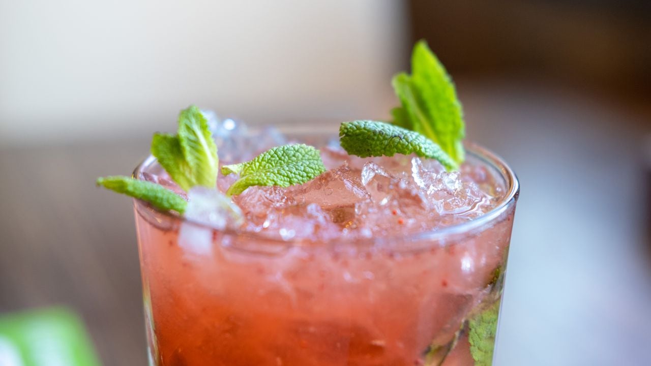 Raspberry mojito with ice and mint. Refreshing cold drink.
