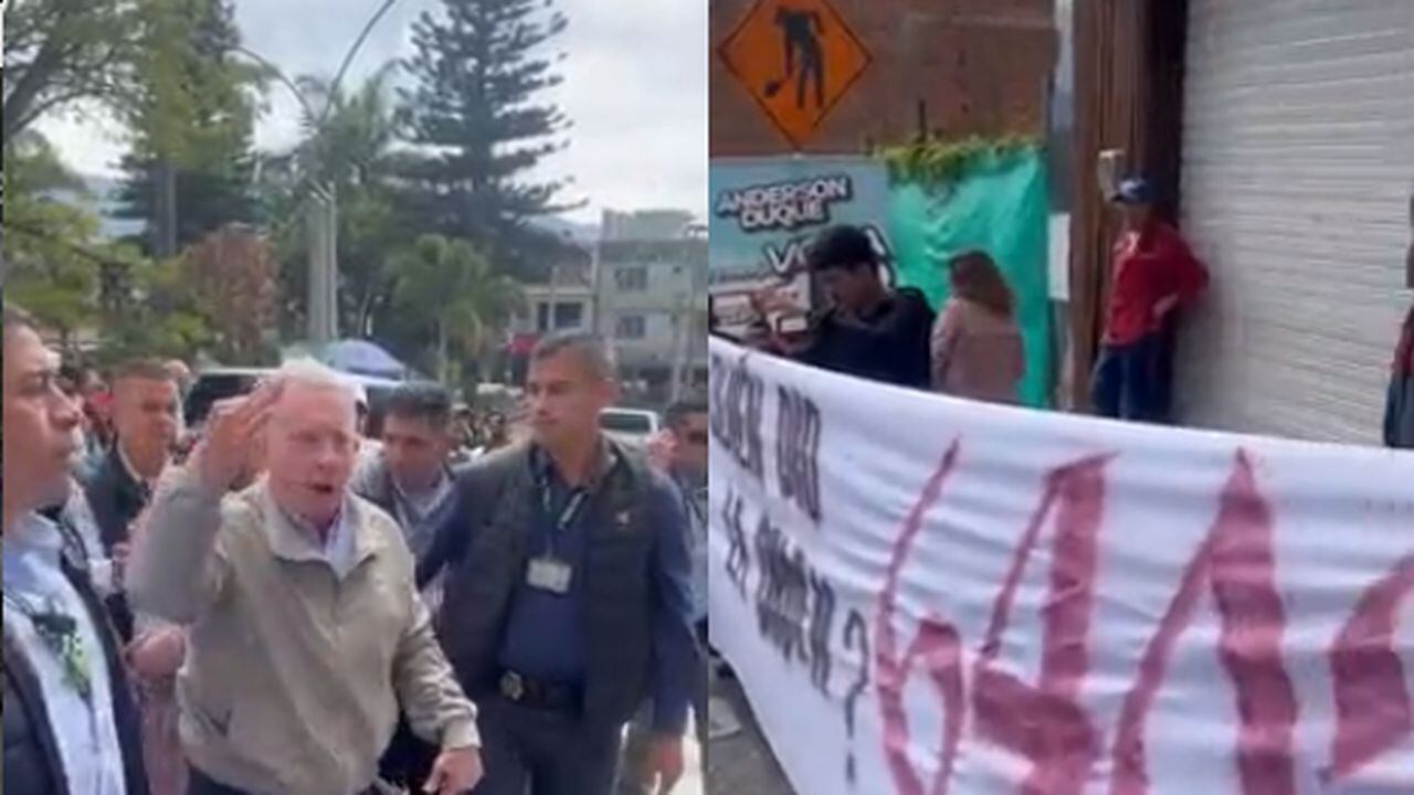 Durante su visita, Uribe se encontró con un grupo de jóvenes que llevaban una pancarta con la inscripción “¿Quién dio la orden 6.402?”