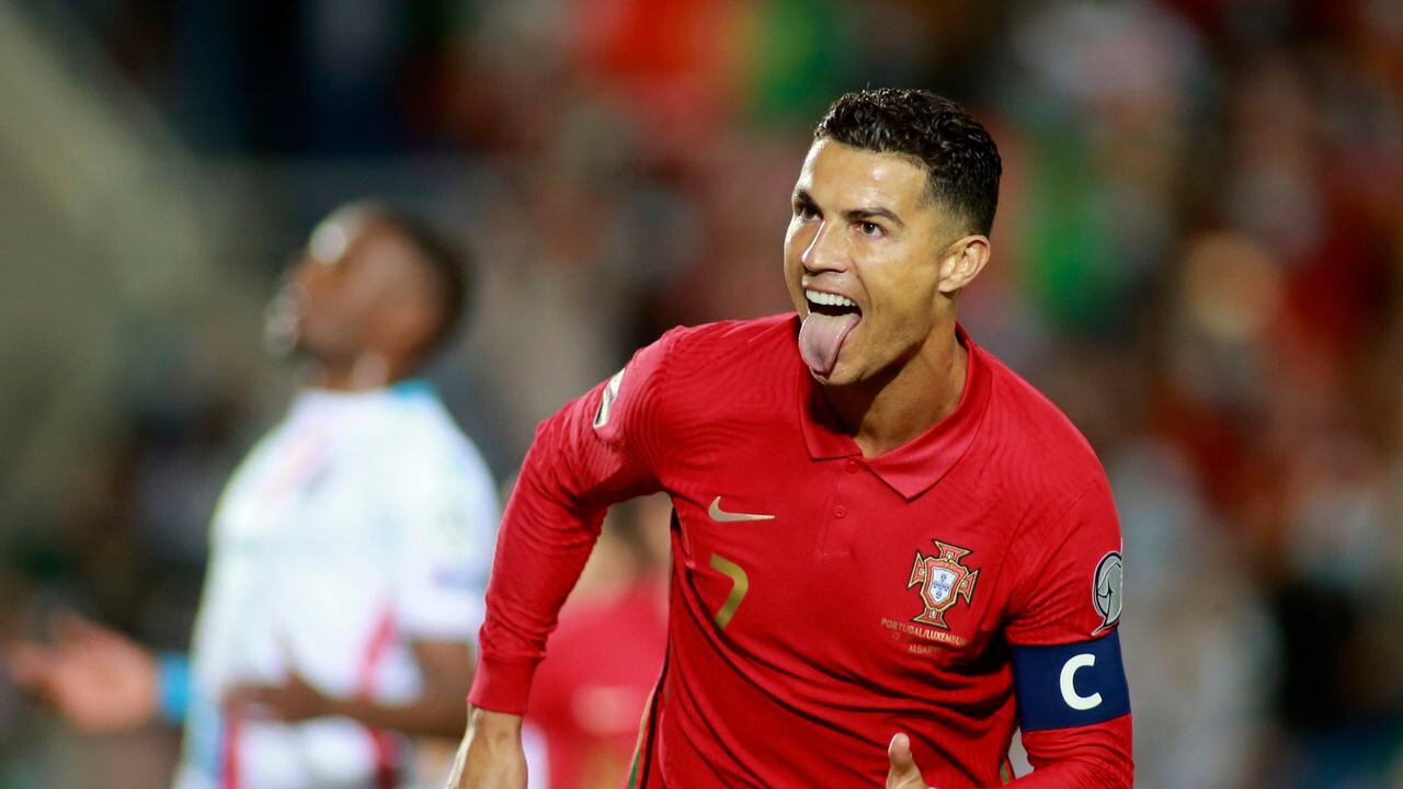 Portugal's Cristiano Ronaldo celebrates after scoring his side's second goal from the penalty spot during the World Cup 2022 group A qualifying soccer match between Portugal and Luxembourg at the Algarve stadium outside Faro, Portugal, Tuesday, Oct. 12, 2021. (AP Photo/Joao Matos)