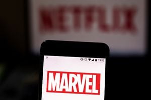 BRAZIL - 2019/08/16: In this photo illustration the Marvel logo is seen displayed on a smartphone and logo Netflix on the blurred background. (Photo Illustration by Rafael Henrique/SOPA Images/LightRocket via Getty Images)