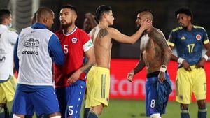 SANTIAGO, CHILE - OCTOBER 13: James Rodríguez of Colombia (L) exchanges jerseys with Arturo Vidal of Chile during a match between Chile and Colombia as part of South American Qualifiers for Qatar 2022 at Estadio Nacional de Chile on October 13, 2020 in Santiago, Chile. (Photo by Esteban Felix-Pool/Getty Images)