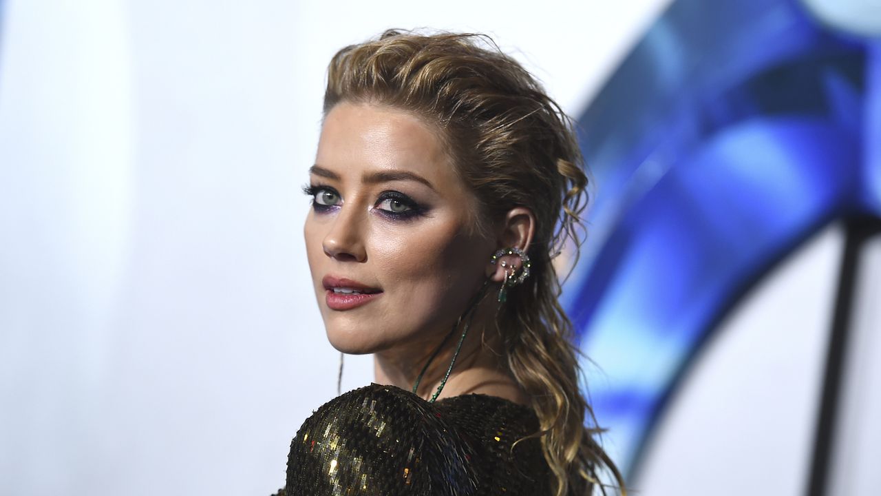 FILE - Amber Heard arrives at the premiere of "Aquaman" on Dec. 12, 2018, in Los Angeles. Heard says she’s become a mom and did it on her own terms, as a single parent. In an Instagram post, the actor said she welcomed daughter Oonagh Paige Heard on April 8, 2021. (Photo by Jordan Strauss/Invision/AP, File)