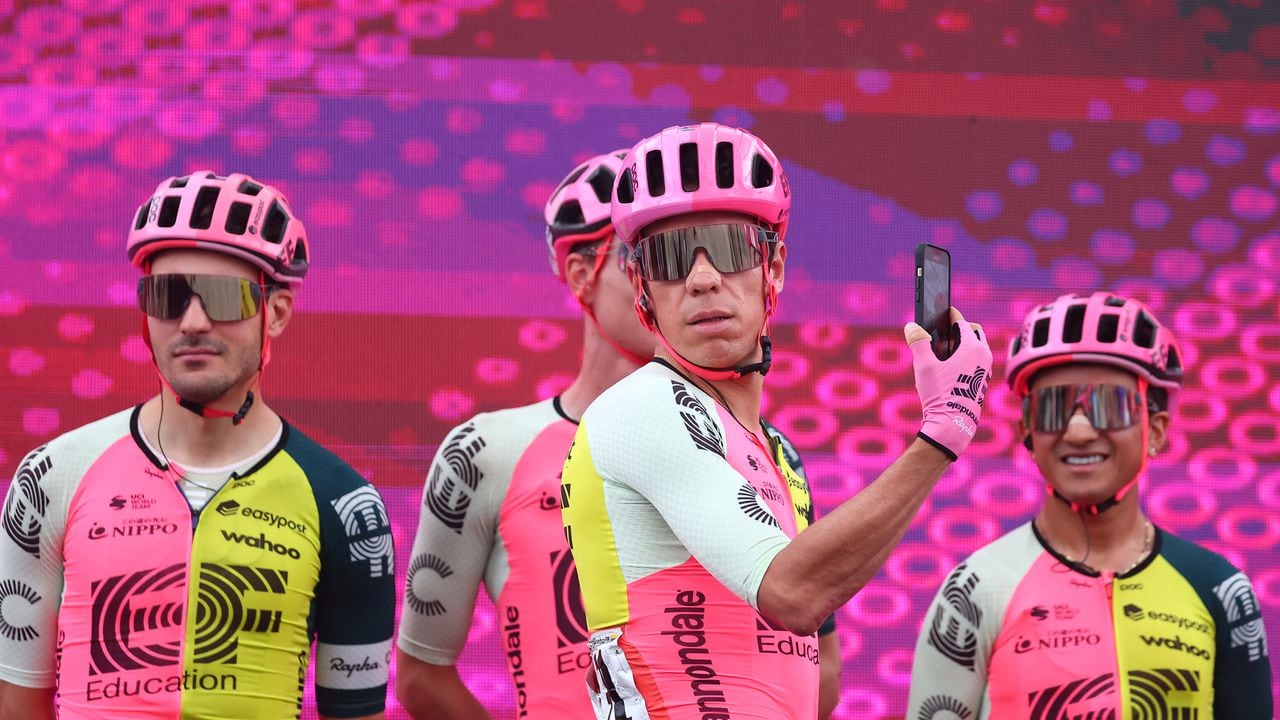 EF Education-EasyPost's Colombian rider Rigoberto Uran (C) and teammates stand on the podium during the teams' presentation, prior to the seventh stage of the Giro d'Italia 2023 cycling race, 218 km between Capua and Gran Sasso d'Italia, on May 12, 2023. (Photo by Luca Bettini / AFP)