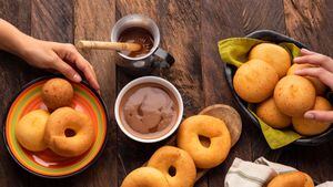 Traditional Colombian breakfast - Buñuelo, pandequeso, almojabana, coffee and chocolate