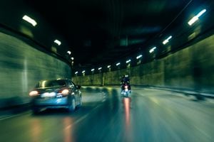 Long Exposure of fast Car and Motorcycle inside a tunnel in a city