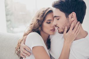 Recreation delight weekend holiday happiness satisfaction concept. Head shot portrait of romantic sexy couple keeping eyes closed enjoying time together kissing bonding indoor