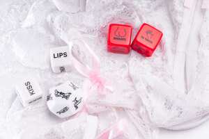 Cube with sexy poses, Kama Sutra. Toys for adults. Sex toys. Cubes with Kama Sutra poses for sex games. Playing cubes of red and white color for sexual games.