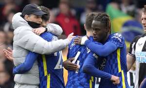 Chelsea's head coach Thomas Tuchel, left, celebrates with players at the end of the English Premier League soccer match between Chelsea and Newcastle United at Stamford Bridge stadium in London, Sunday, March 13, 2022. (AP Photo/Kirsty Wigglesworth)