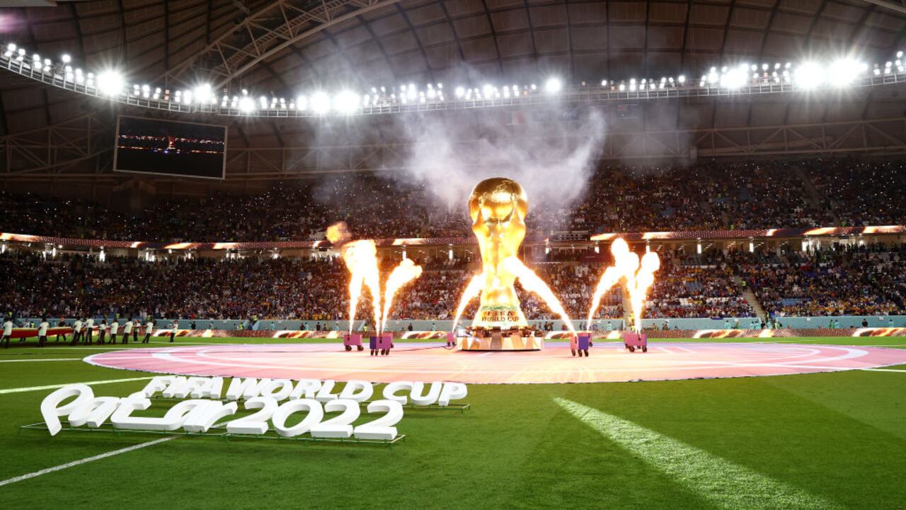 AL WAKRAH, QATAR - NOVEMBER 22: Pyrotechnics explode around a giant FIFA World Cup trophy prior to the FIFA World Cup Qatar 2022 Group D match between France and Australia at Al Janoub Stadium on November 22, 2022 in Al Wakrah, Qatar. (Photo by Robert Cianflone/Getty Images)