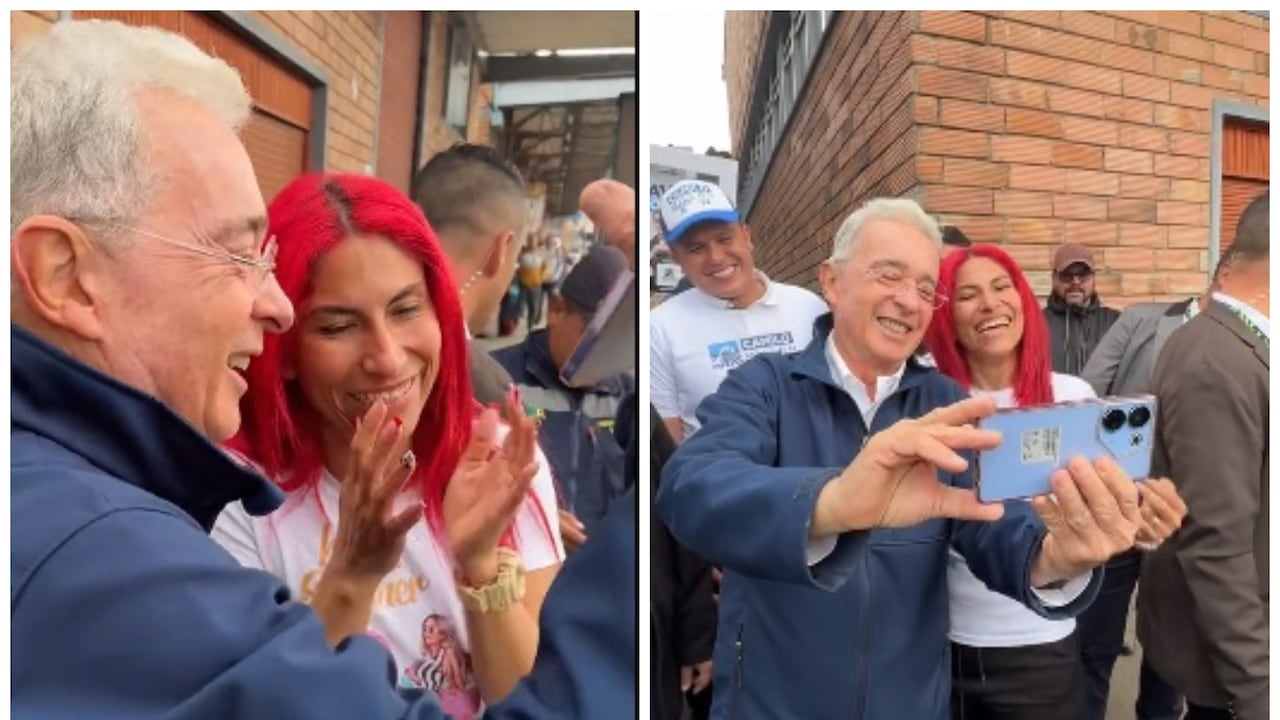 Álvaro Uribe junto a una seguidora que le pidió una fotografía.