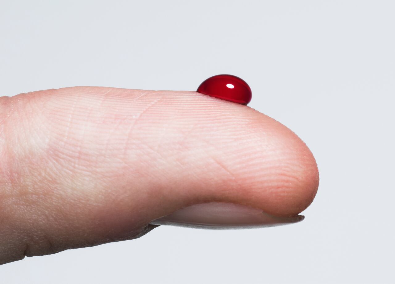 Finger with a bead of blood
