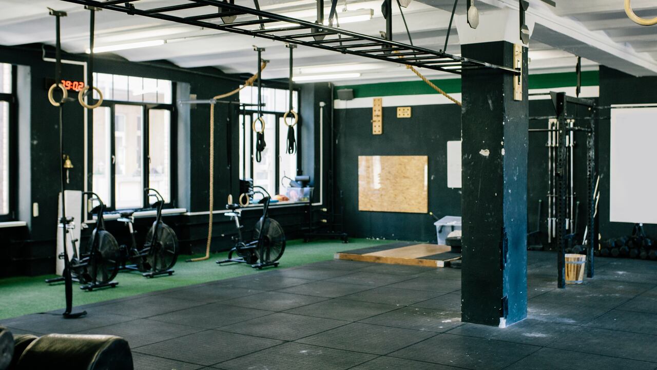 An empty gym scene with various types of equipment ready for use.
