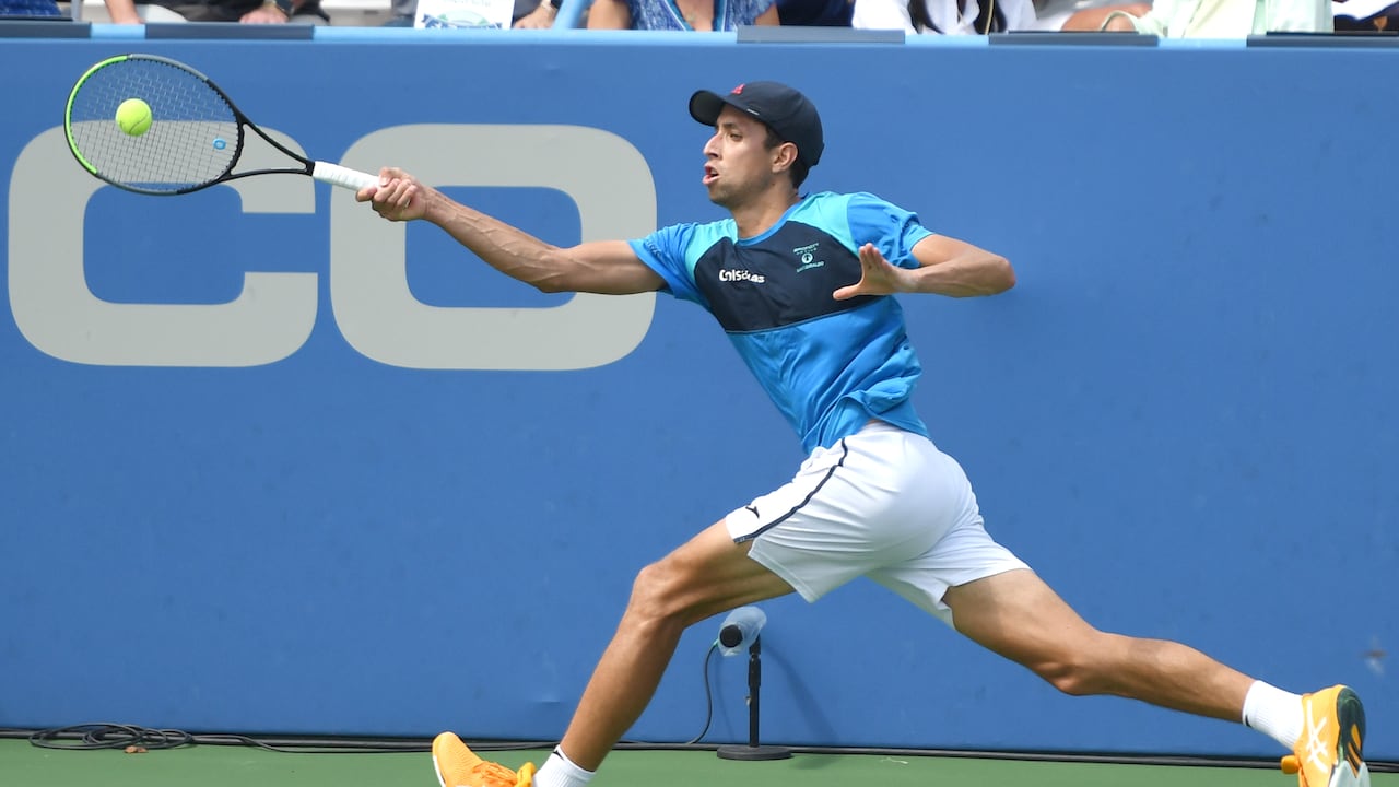 WASHINGTON, DC - AUGUST 02: Daniel Elahi Galán of Colombia returns a shot during a match against Tommy Paul of the United States on Day 3 during the Citi Open at Rock Creek Tennis Center on August 2, 2021 in Washington, DC. (Photo by Mitchell Layton/Getty Images)