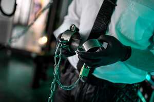 06 July 2020, Berlin: Dominos Berlin, sex worker, stands handcuffed in the steel room in the Domina Bizarre Studio LUX. During a backstage tour in the dominatrix studio Dominos wants to draw attention to the work situation and consequences of corona-blocks for sex workers. +++Attention!!! For editorial use only !!! +++ Photo: Britta Pedersen/dpa-Zentralbild/dpa - ATTENTION: Only for editorial use in connection with current reporting and only with full mention of the above credit. (Photo by Britta Pedersen/picture alliance via Getty Images)