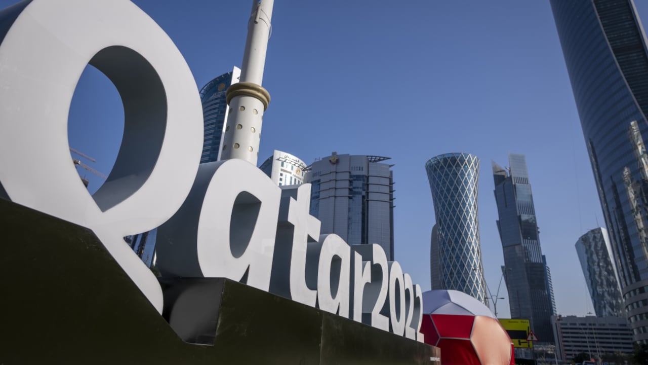 FILE - Branding is displayed near the Doha Exhibition and Convention Center in Doha, Qatar, Thursday, March 31, 2022. Qatar’s ruling emir has lashed out at criticism of the country over its hosting of the 2022 FIFA World Cup, complaining of an “unprecedented campaign” targeting the first Arab nation to hold the tournament. (AP/Darko Bandic, File)