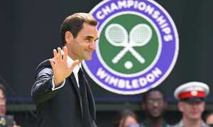 LONDON, ENGLAND - JULY 03: Roger Federer of Switzerland acknowledges spectators at the Centre Court Centenary Celebration on day seven of the Wimbledon Tennis Championships at the All England Lawn Tennis and Croquet Club on July 03, 2022 in London, England. (Photo by Karwai Tang/WireImage)