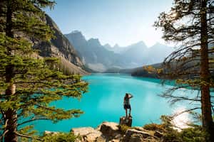 A young woman taking in the scenic view of Lake Moraine