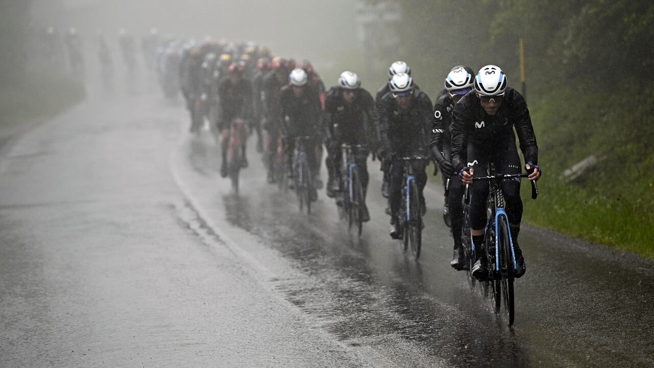 Cyclists make their way under a pouring rain during the 10th stage of the Giro D'Italia, tour of Italy cycling race, from Scandiano to Viareggio, Italy, Tuesday, May 16, 2023. (Fabio Ferrari/LaPresse via AP)