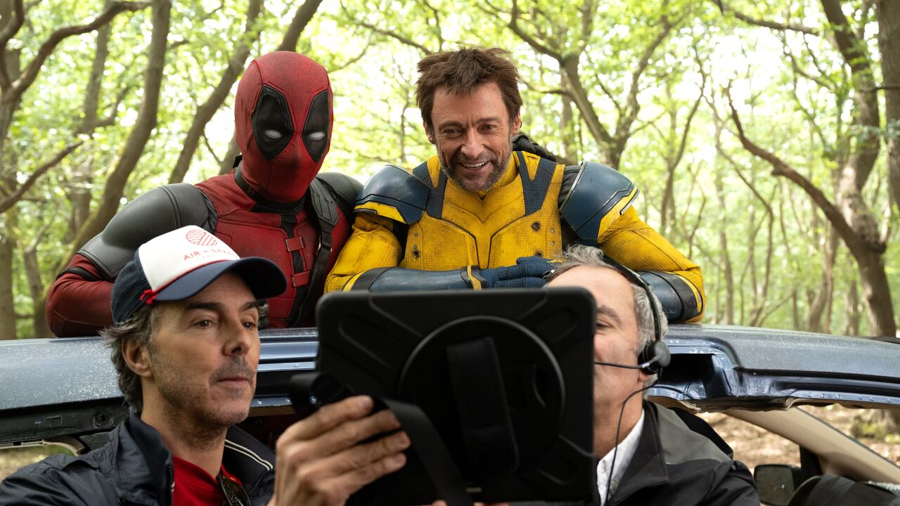 (L-R): Director Shawn Levy, Ryan Reynolds, and Hugh Jackman on the set of Marvel Studios' DEADPOOL & WOLVERINE. Photo by Jay Maidment. © 2024 20th Century Studios / © and ™ 2024 MARVEL.