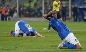 Italy's Joao Pedro reacts after missing a scoring chance in the World Cup qualifying play-offsoccer match between Italy and North Macedonia, at Renzo Barbera stadium, in Palermo, Italy, Thursday, March 24, 2022. North Macedonia won 1-0. (AP Photo/Antonio Calanni)