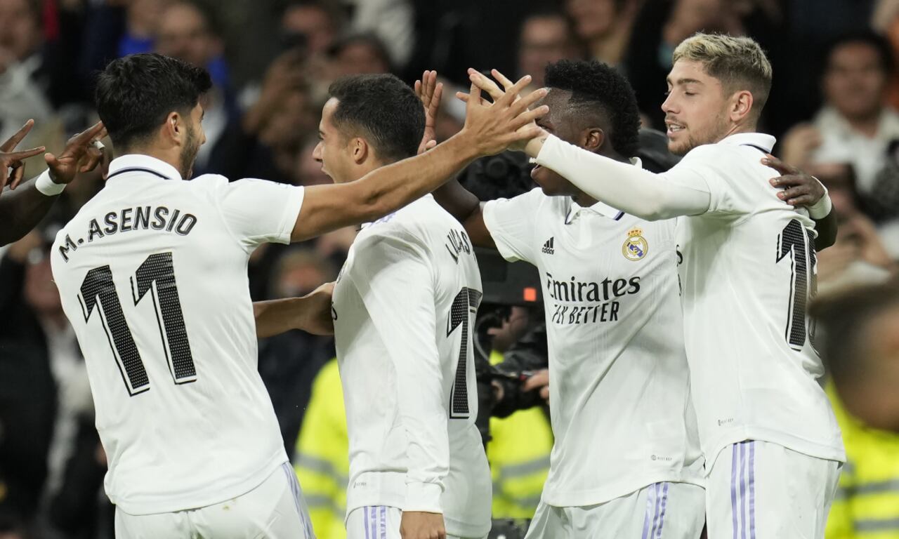Real Madrid's Lucas Vazquez, second from left, celebrates with teammates after scoring his side's second goal during the Spanish La Liga soccer match between Real Madrid and Sevilla at the Santiago Bernabeu stadium in Madrid, Saturday, Oct. 22, 2022. (AP/Manu Fernandez)