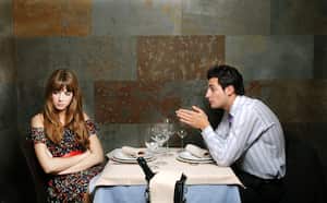 Young couple with relationship difficulties at a restaurant.