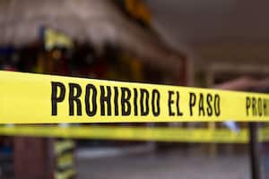 Yellow no cross tape with sign - Prohibido El Pasa