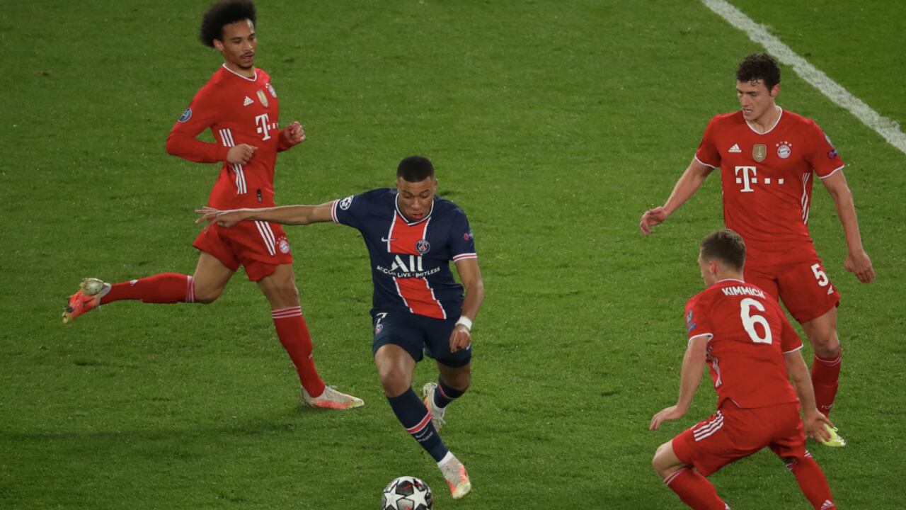 PARIS, FRANCE - APRIL 13: Kylian Mbappe of Paris Saint-Germain in action with Benjamin Pavard, Joshua Kimmich and Leroy Sane of FC Bayern Munich during the UEFA Champions League Quarter Final Second Leg match between Paris Saint-Germain and FC Bayern Munich at Parc des Princes on April 13, 2021 in Paris, France. (Photo by Getty Images/Xavier Laine)