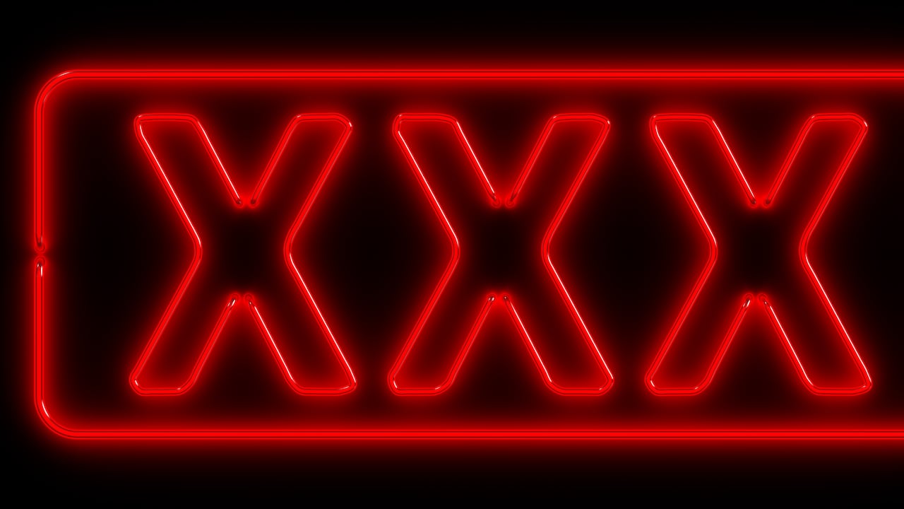 Neon signboard: XXX. 3D render. Isolated on black
