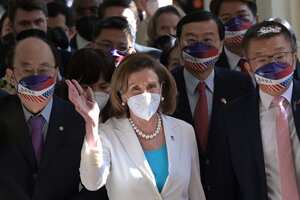 Visiting US House Speaker Nancy Pelosi (C) waves to journalists during her arrival at the Parliament in Taipei on August 3, 2022. (Photo by Sam Yeh / AFP)