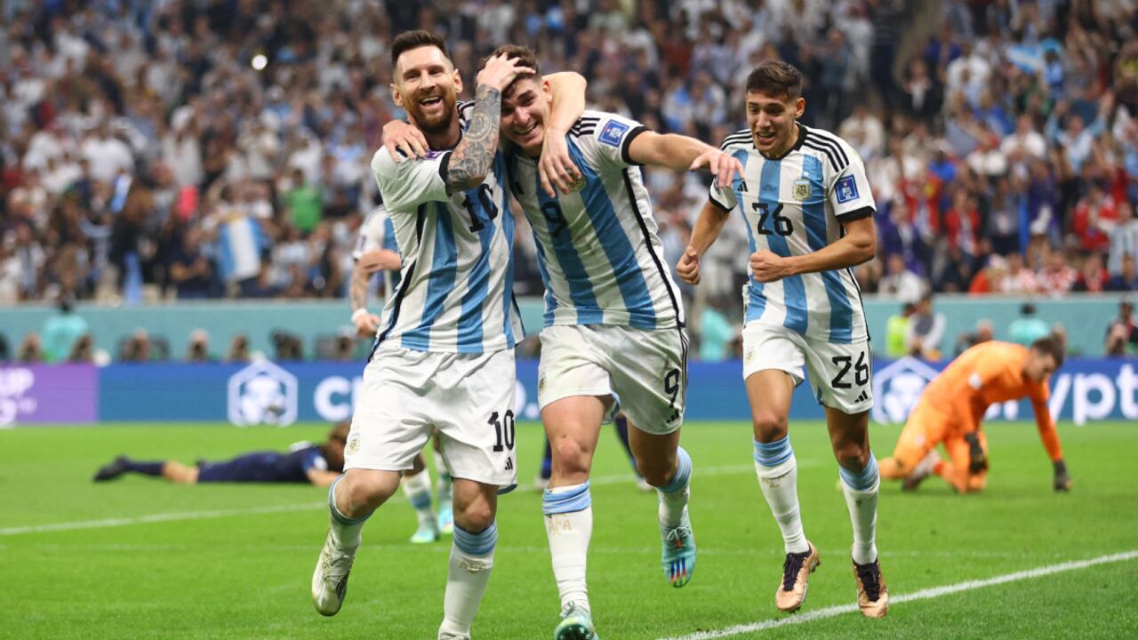 Soccer Football - FIFA World Cup Qatar 2022 - Semi Final - Argentina v Croatia - Lusail Stadium, Lusail, Qatar - December 13, 2022 Argentina's Julian Alvarez celebrates scoring their second goal with Lionel Messi and Nahuel Molina REUTERS/Carl Recine