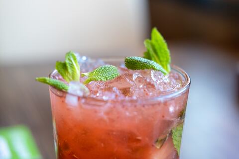 Raspberry mojito with ice and mint. Refreshing cold drink.