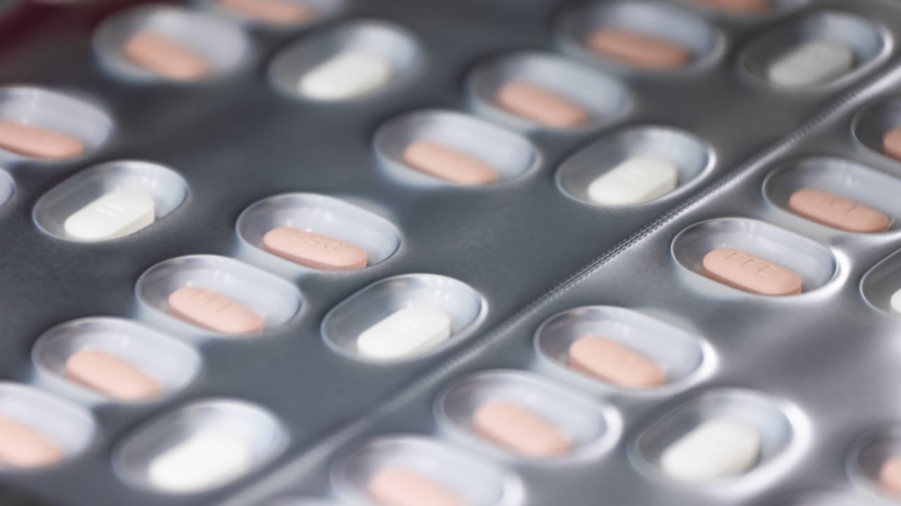 24 May 2022, Baden-Wuerttemberg, Freiburg im Breisgau: Tablets of the drug Paxlovid for the treatment of Covid-19 pass through a packaging line in a building owned by Pfizer. The facility is designed to enable an automated production process of drugs, including antiviral tablets against Covid-19. Photo: Philipp von Ditfurth/dpa (Photo by Philipp von Ditfurth/picture alliance via Getty Images)