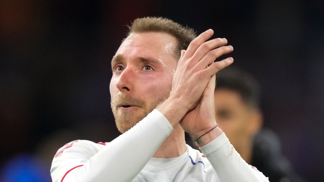 Denmark's Christian Eriksen greets cheering fans after the international friendly soccer match between the Netherlands and Denmark at the Johan Cruyff ArenA in Amsterdam, Netherlands, Saturday, March 26, 2022. The match was Eriksen's first appearance for Denmark since he collapsed after suffering a cardiac arrest during a European Championship game in June. The Netherlands-Denmark friendly was being played at Amsterdam's Johan Cruyff Arena, where Eriksen made his name as a playmaker for Dutch club Ajax. (AP Photo/Peter Dejong)