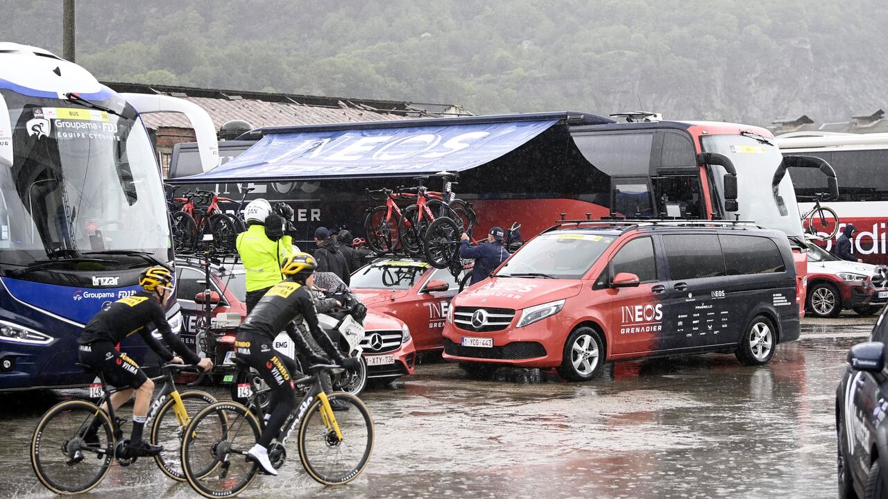Cyclists' bicycles are loaded onto vehicles after the first section of stage 13 of the Giro d'Italia cycling race, from Borgofranco d'Ivrea to Crans Montana, Switzerland, was canceled due to bad weather conditions, in Borgofranco d'Ivrea, Italy, Friday, May 19, 2023. (Fabio Ferrari/LaPresse via AP)