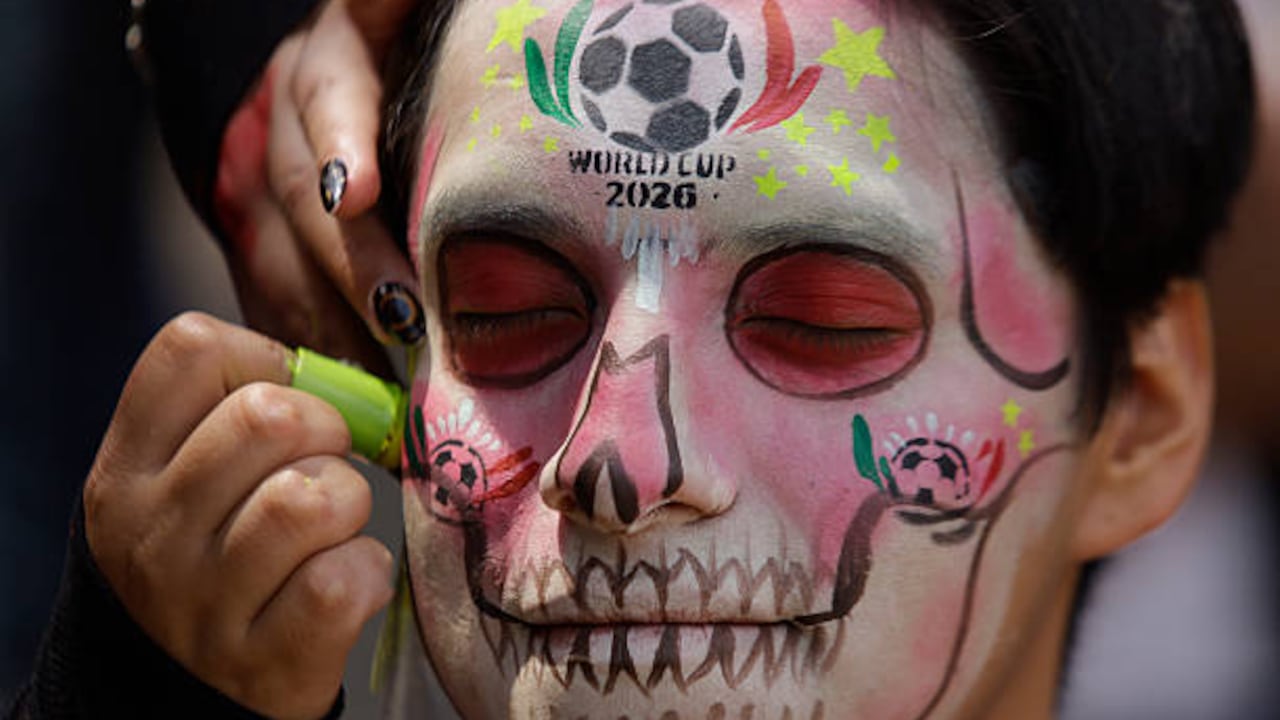 A makeup session takes place during the Catrinas World Cup Parade, which departs from the Angel of Independence and proceeds to the Palace of Fine Arts in Mexico City, on March 22, 2026. The event occurs on the eve of the 2026 World Cup, scheduled to be held on June 11. (Photo by Gerardo Vieyra/NurPhoto via Getty Images)