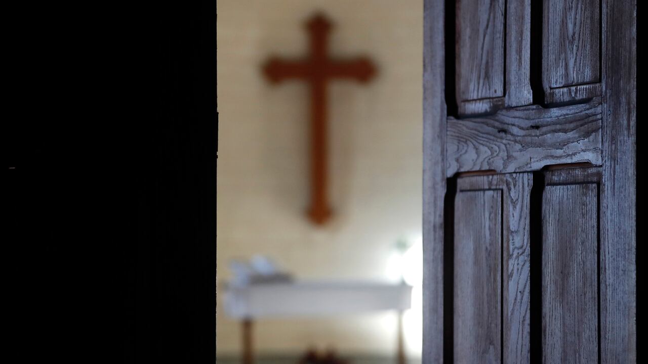 Protestant church. Altar and christian cross. France.
