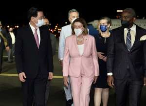 TAIPEI, TAIWAN - AUGUST 2: (----EDITORIAL USE ONLY - MANDATORY CREDIT - "TAIWANESE FOREIGN MINISTRY / HANDOUT" - NO MARKETING NO ADVERTISING CAMPAIGNS - DISTRIBUTED AS A SERVICE TO CLIENTS----) US House Speaker Nancy Pelosi (C) being welcomed by Taiwanese Foreign Minister Joseph Wu (L) after landing at Songshan Airport in Taipei, Taiwan on August 2, 2022. (Photo by Taiwanese Foreign Ministry / Handout/Anadolu Agency via Getty Images)