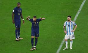Soccer Football - FIFA World Cup Qatar 2022 - Final - Argentina v France - Lusail Stadium, Lusail, Qatar - December 18, 2022 France's Kylian Mbappe gestures next to Marcus Thuram and Argentina's Lionel Messi REUTERS/Paul Childs