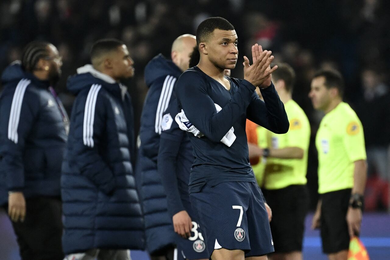 Paris Saint-Germain's French forward Kylian Mbappe applauds at the end of the French L1 football match between Paris Saint-Germain (PSG) and Olympique Lyonnais (OL) at The Parc des Princes Stadium in Paris on April 2, 2023. (Photo by STEPHANE DE SAKUTIN / AFP)