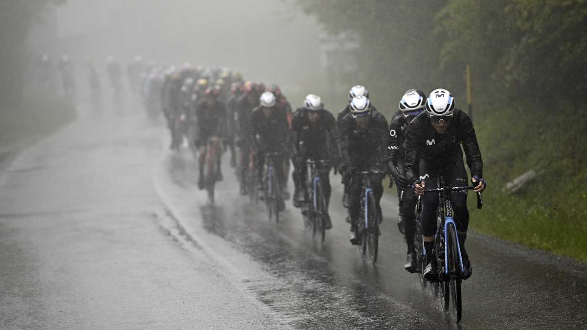 Cyclists make their way under a pouring rain during the 10th stage of the Giro D'Italia, tour of Italy cycling race, from Scandiano to Viareggio, Italy, Tuesday, May 16, 2023. (Fabio Ferrari/LaPresse via AP)